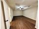 Large bedroom featuring vinyl wood floors, bright natural light, and a tray ceiling at 107 Oconnor Dr, Dallas, GA 30157