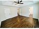 Open bedroom featuring hardwood floors, bright natural light, and multiple access doors at 107 Oconnor Dr, Dallas, GA 30157