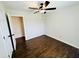 Spare bedroom showing hardwood floors, ceiling fan and closet entrance to the left at 107 Oconnor Dr, Dallas, GA 30157
