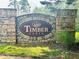 Stone entrance sign to Timber Creek, showcasing the community's natural setting and established neighborhood at 107 Oconnor Dr, Dallas, GA 30157