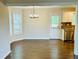Dining room with chandelier, hardwood floors and access to the kitchen at 107 Oconnor Dr, Dallas, GA 30157
