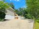 Long driveway leading to a two-car garage and backyard at 107 Oconnor Dr, Dallas, GA 30157