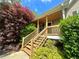 Front porch with wood stairs and landscaping at 107 Oconnor Dr, Dallas, GA 30157