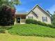 Charming home with a covered porch and well-maintained landscaping at 107 Oconnor Dr, Dallas, GA 30157