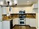 Kitchen features stainless steel appliances, granite countertops and white cabinets at 107 Oconnor Dr, Dallas, GA 30157