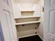 Neat laundry room with upper cabinets, a shelf, washer hookup, and dark hardwood floors at 107 Oconnor Dr, Dallas, GA 30157