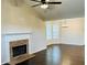 Living room with hardwood floors, fireplace, ceiling fan and many windows at 107 Oconnor Dr, Dallas, GA 30157
