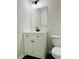 Stylish powder room featuring a modern vanity with sleek black fixtures and an eco-friendly toilet at 107 Oconnor Dr, Dallas, GA 30157