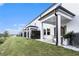 Townhome with a covered patio and well-maintained lawn, perfect for outdoor enjoyment at 1704 Hyssop Se Blvd, Smyrna, GA 30126