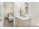 Charming bathroom with a modern vanity, gold accents, and an adjacent bedroom at 1704 Hyssop Se Blvd, Smyrna, GA 30126