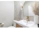 Modern half bathroom featuring a stylish vanity, elegant mirror, and contemporary design at 1704 Hyssop Se Blvd, Smyrna, GA 30126