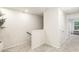 Neutral carpeted hallway with bright white walls and a view into a naturally lit room at 1704 Hyssop Se Blvd, Smyrna, GA 30126