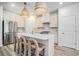 Modern kitchen with stainless steel appliances, a central island, pendant lighting, and barstool seating at 1704 Hyssop Se Blvd, Smyrna, GA 30126