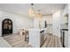Open-concept kitchen with island, modern cabinetry, stainless steel appliances, and stylish pendant lighting at 1704 Hyssop Se Blvd, Smyrna, GA 30126