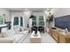 Bright living room with large windows, comfortable seating, and contemporary decor at 1704 Hyssop Se Blvd, Smyrna, GA 30126