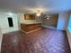 Finished basement with a wet bar, tile flooring, and ample space for entertaining or relaxing at 2577 Ozella Sw Pl, Atlanta, GA 30331