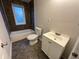 Bathroom features a shower-tub combo and vanity at 2577 Ozella Sw Pl, Atlanta, GA 30331