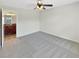 Clean bedroom with neutral carpet adjacent to bathroom with granite countertop vanity at 2577 Ozella Sw Pl, Atlanta, GA 30331
