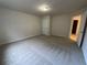 Large bedroom with neutral carpet and a walk-in closet at 2577 Ozella Sw Pl, Atlanta, GA 30331