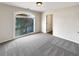 Well lit bedroom featuring plush carpeting and large window at 2577 Ozella Sw Pl, Atlanta, GA 30331