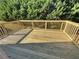 The wooden deck is newly refinished with railings and is ready for entertaining or enjoying the quiet outdoors at 2577 Ozella Sw Pl, Atlanta, GA 30331