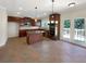 Spacious kitchen featuring stainless appliances, granite countertops, an island, and access to an outdoor deck at 2577 Ozella Sw Pl, Atlanta, GA 30331