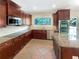 Modern kitchen with granite countertops, stainless steel appliances and rich wood cabinetry at 2577 Ozella Sw Pl, Atlanta, GA 30331