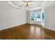 Bright living room features gorgeous hardwood floors, a tray ceiling, and bay windows at 2577 Ozella Sw Pl, Atlanta, GA 30331