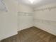 Empty walk-in closet with carpeted floors and wire shelving on the walls at 2577 Ozella Sw Pl, Atlanta, GA 30331