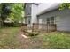 Backyard view featuring a wooden deck, gray siding and lawn at 2907 Oakvale Falls Dr, Decatur, GA 30034