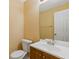 A clean, well-lit bathroom featuring a toilet, vanity and mirror at 2907 Oakvale Falls Dr, Decatur, GA 30034