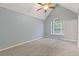 Large bedroom offering neutral colored walls, carpet, and a window for natural light at 2907 Oakvale Falls Dr, Decatur, GA 30034