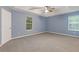 Large bedroom boasts carpet, neutral walls and 2 windows for ample light at 2907 Oakvale Falls Dr, Decatur, GA 30034