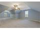 Large bonus room with a ceiling fan and windows providing natural light at 2907 Oakvale Falls Dr, Decatur, GA 30034