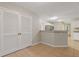 Breakfast nook with tile floors, closet and a view of kitchen through the cutout at 2907 Oakvale Falls Dr, Decatur, GA 30034