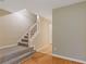 Entryway hallway with carpeted staircase to the right and tiled flooring in the hallway at 2907 Oakvale Falls Dr, Decatur, GA 30034