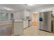 Kitchen with stainless steel appliances, breakfast bar and a view of backyard through windows at 2907 Oakvale Falls Dr, Decatur, GA 30034
