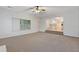 Large living room with carpeted floors and an open view to the kitchen at 2907 Oakvale Falls Dr, Decatur, GA 30034