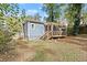 Home exterior with a screened-in porch and a spacious backyard at 1686 Alvarado Sw Ter, Atlanta, GA 30310