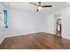 Spacious bedroom with hardwood floors, ceiling fan, and a doorway to the kitchen at 1686 Alvarado Sw Ter, Atlanta, GA 30310