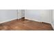 This empty bedroom has hardwood flooring and white trim at 1686 Alvarado Sw Ter, Atlanta, GA 30310