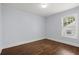 Cozy bedroom features hardwood floors and natural light streaming through a window at 1686 Alvarado Sw Ter, Atlanta, GA 30310