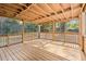 Inviting outdoor deck featuring a wood floor, exposed beam ceiling, and backyard views at 1686 Alvarado Sw Ter, Atlanta, GA 30310