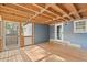 Covered deck with wood flooring and access to the home's interior at 1686 Alvarado Sw Ter, Atlanta, GA 30310