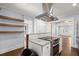 Kitchen featuring a range hood, granite countertops, and hardwood floors at 1686 Alvarado Sw Ter, Atlanta, GA 30310