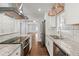 Updated kitchen with granite counters, stainless steel appliances, and white cabinets at 1686 Alvarado Sw Ter, Atlanta, GA 30310