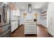 Modern kitchen boasting stainless steel appliances, white cabinetry, and a kitchen island at 1686 Alvarado Sw Ter, Atlanta, GA 30310