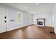 Bright living room with hardwood floors, a fireplace, and abundant natural light at 1686 Alvarado Sw Ter, Atlanta, GA 30310