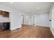 Open living area featuring hardwood floors and a modern bar setup at 1686 Alvarado Sw Ter, Atlanta, GA 30310