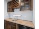 Stylish wet bar featuring custom cabinetry and a convenient wine storage rack at 1686 Alvarado Sw Ter, Atlanta, GA 30310